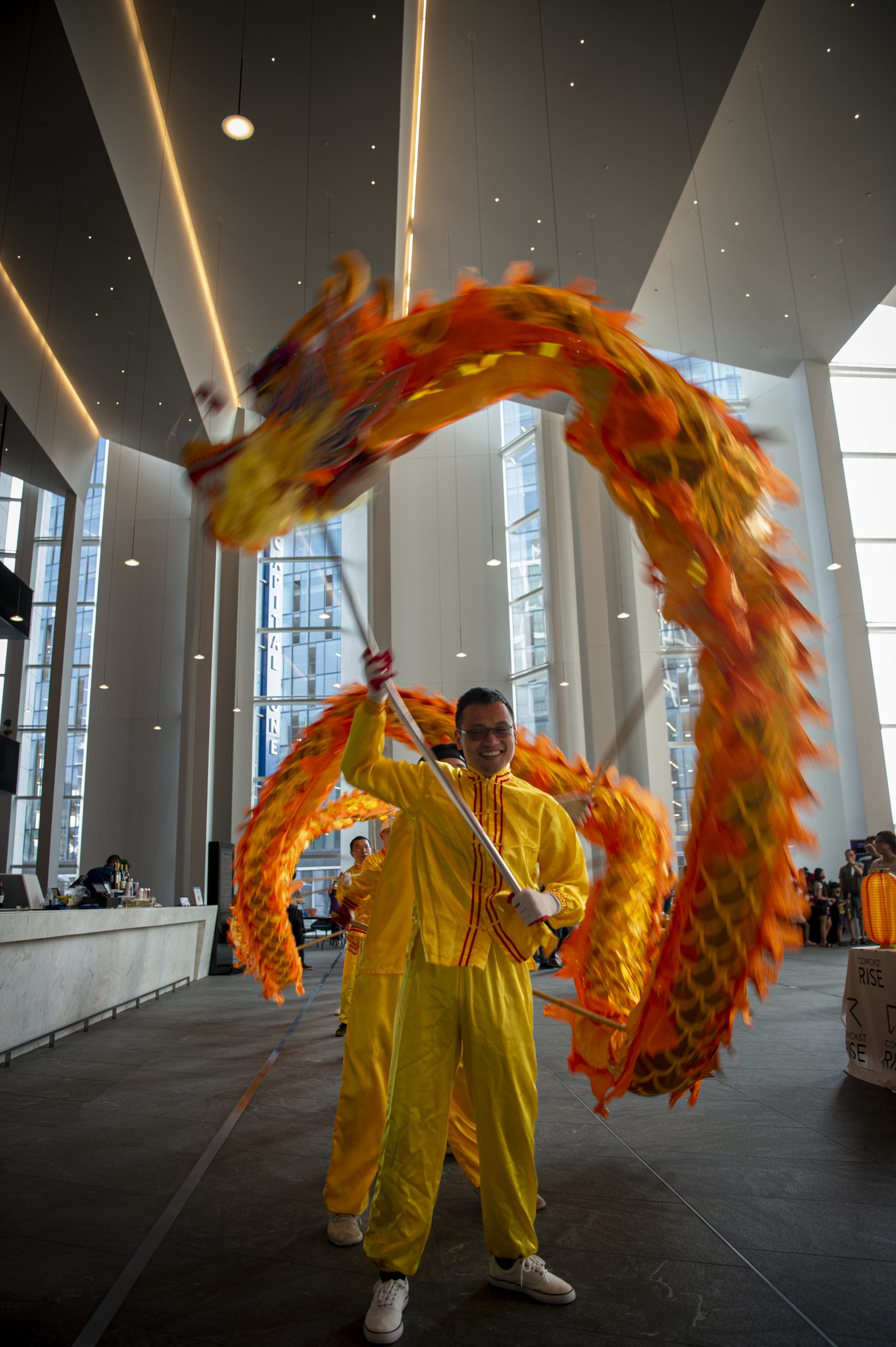 Photo of a dragon dance in the Capital One Hall atrium