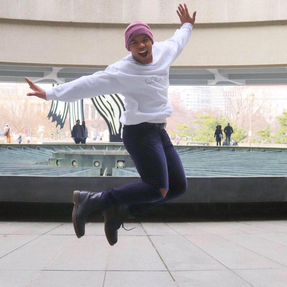 KPop instructor Horizon Miguel jumping in the air.