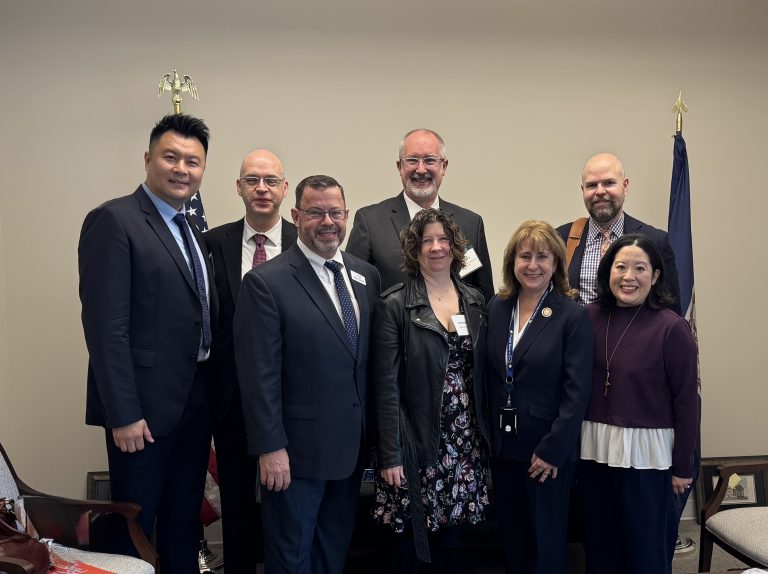 L-R Tim Zhao, Stuart Holt, Jay Dick, John Good, Erin Harms, Delegate Gretchen Bulova, Damon Effingham, Allison Mui