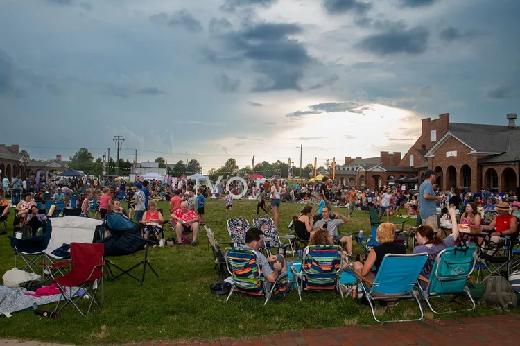People sitting on lawn chairs at Workhouse Arts Center
